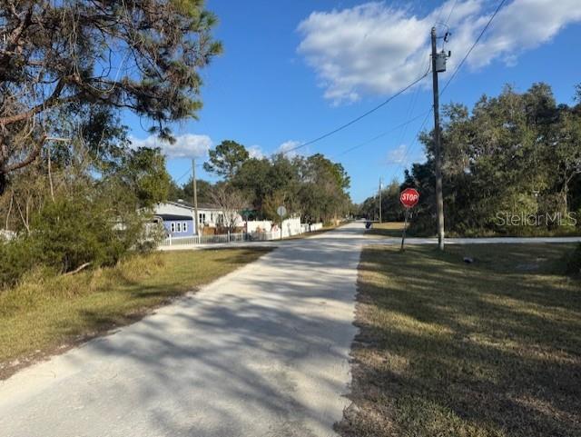 35367 Kramer Street Webster, FL 33597 - Photo 5 of 13 a view of street with houses