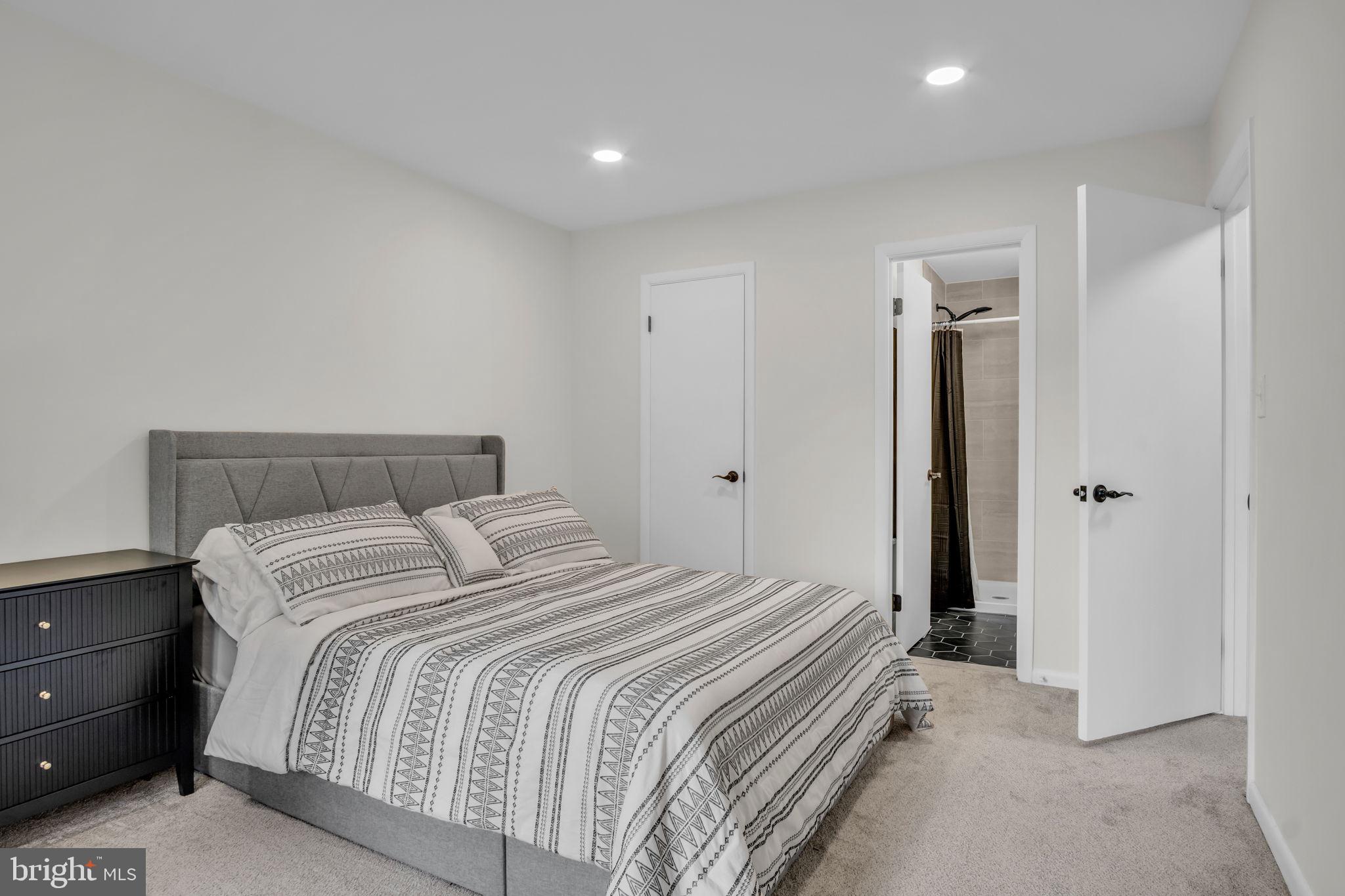 14 Ramsgate Court, Unit 14 York, PA 17404 - Photo 16 of 30 a bedroom with a bed and a mirror