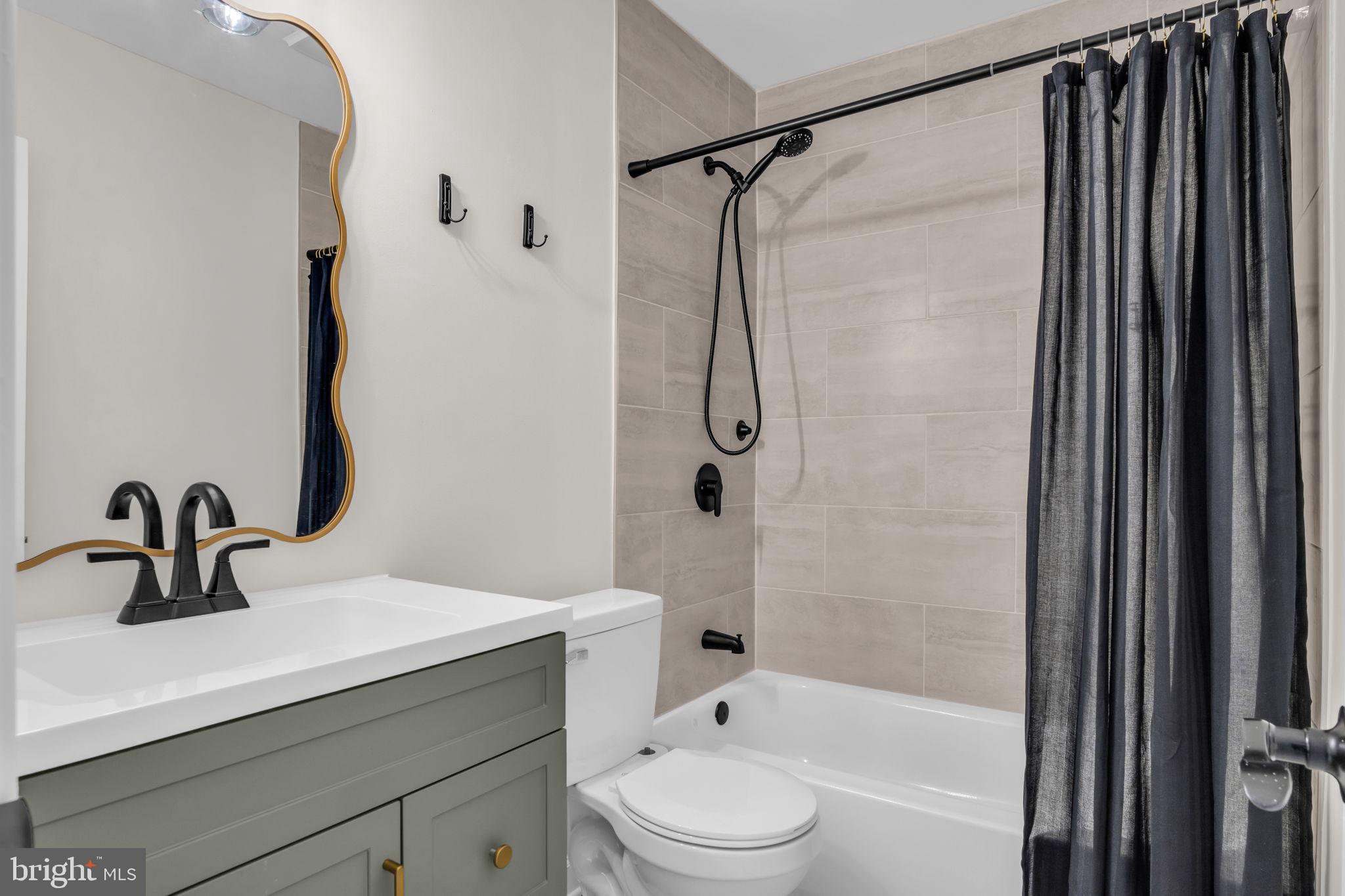 14 Ramsgate Court, Unit 14 York, PA 17404 - Photo 20 of 30 a bathroom with a sink a toilet and a mirror