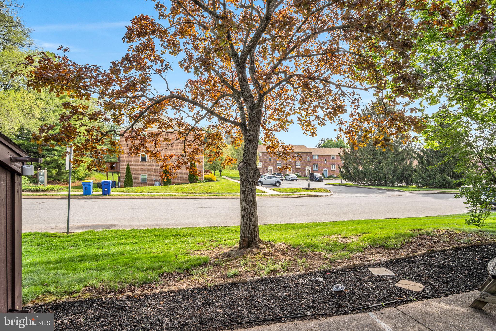 14 Ramsgate Court, Unit 14 York, PA 17404 - Photo 21 of 30 a view of yard with swimming pool and green space