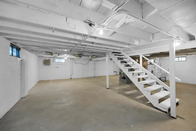 a view of an empty room with windows