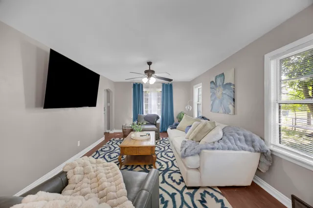 a living room with furniture and a flat screen tv