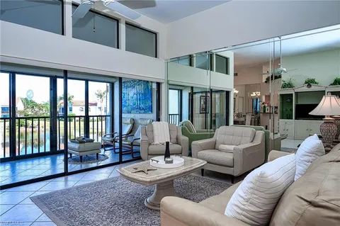 a living room with furniture and a rug