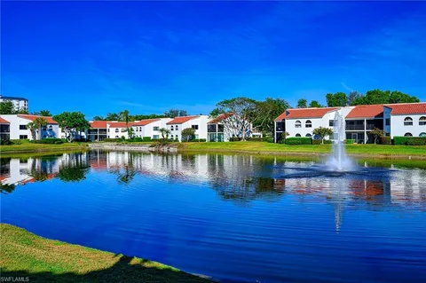 a view of a swimming pool and a yard