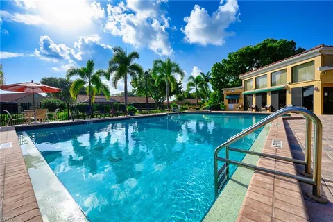 a view of a swimming pool with a patio