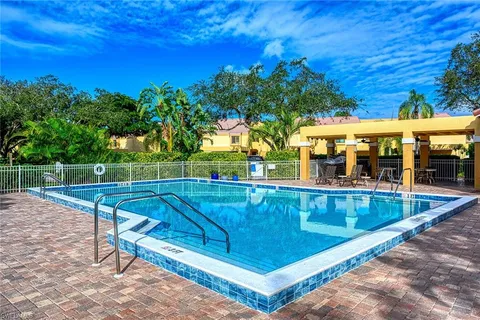 a view of a swimming pool with a patio