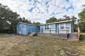 2630 Huggins Road Lake Wales, FL 33898 - Photo 1 of 1 a view of a house with a yard and wooden fence