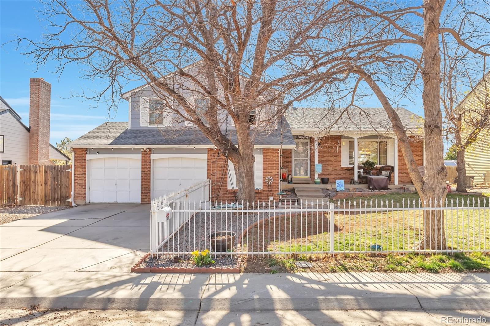 2079 South Quintero Street Aurora, CO 80013 - Photo 1 of 35 a front view of a house with a yard
