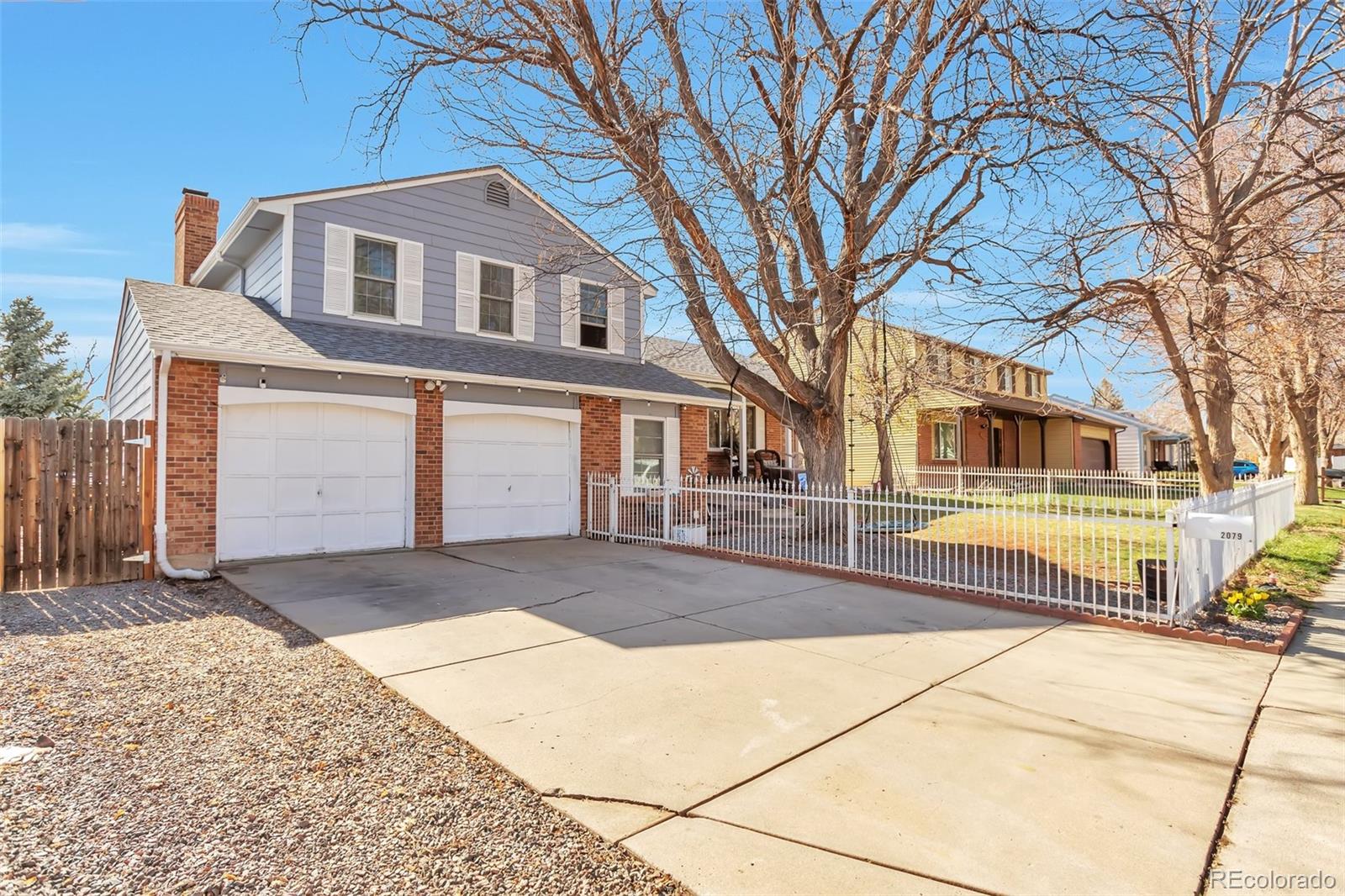2079 South Quintero Street Aurora, CO 80013 - Photo 3 of 35 a front view of a house with a yard