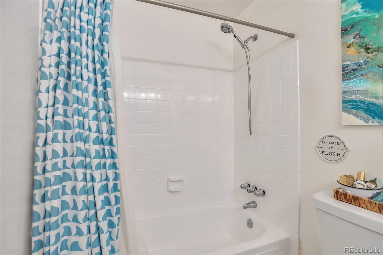 2079 South Quintero Street Aurora, CO 80013 - Photo 31 of 37 a bathroom with a bathtub and a shower curtain