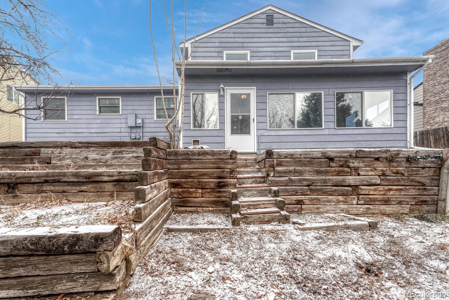 2079 South Quintero Street Aurora, CO 80013 - Photo 34 of 37 a view of a house with a large window and wooden fence