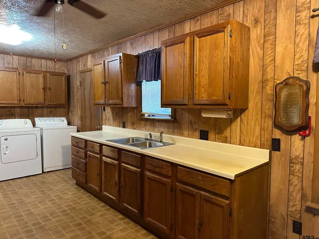 a kitchen with a sink and cabinets
