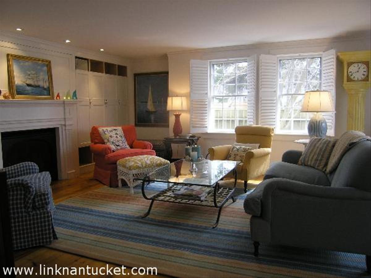 34 R Cliff Road Nantucket, MA 02554 - Photo 2 of 14 a living room with furniture or couch and a fireplace