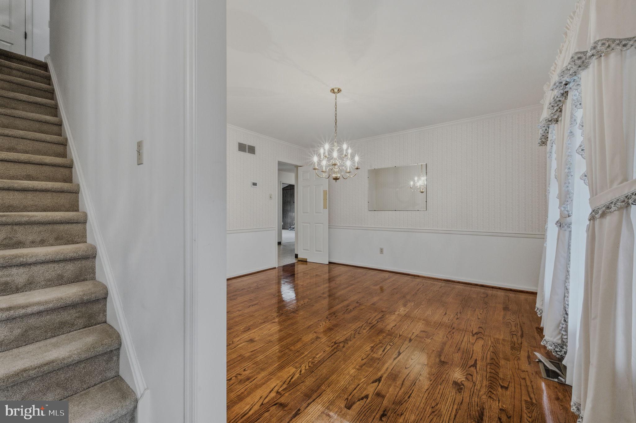 23 Raphael Road Hockessin, DE 19707 - Photo 12 of 44 a view of an empty room with a fireplace