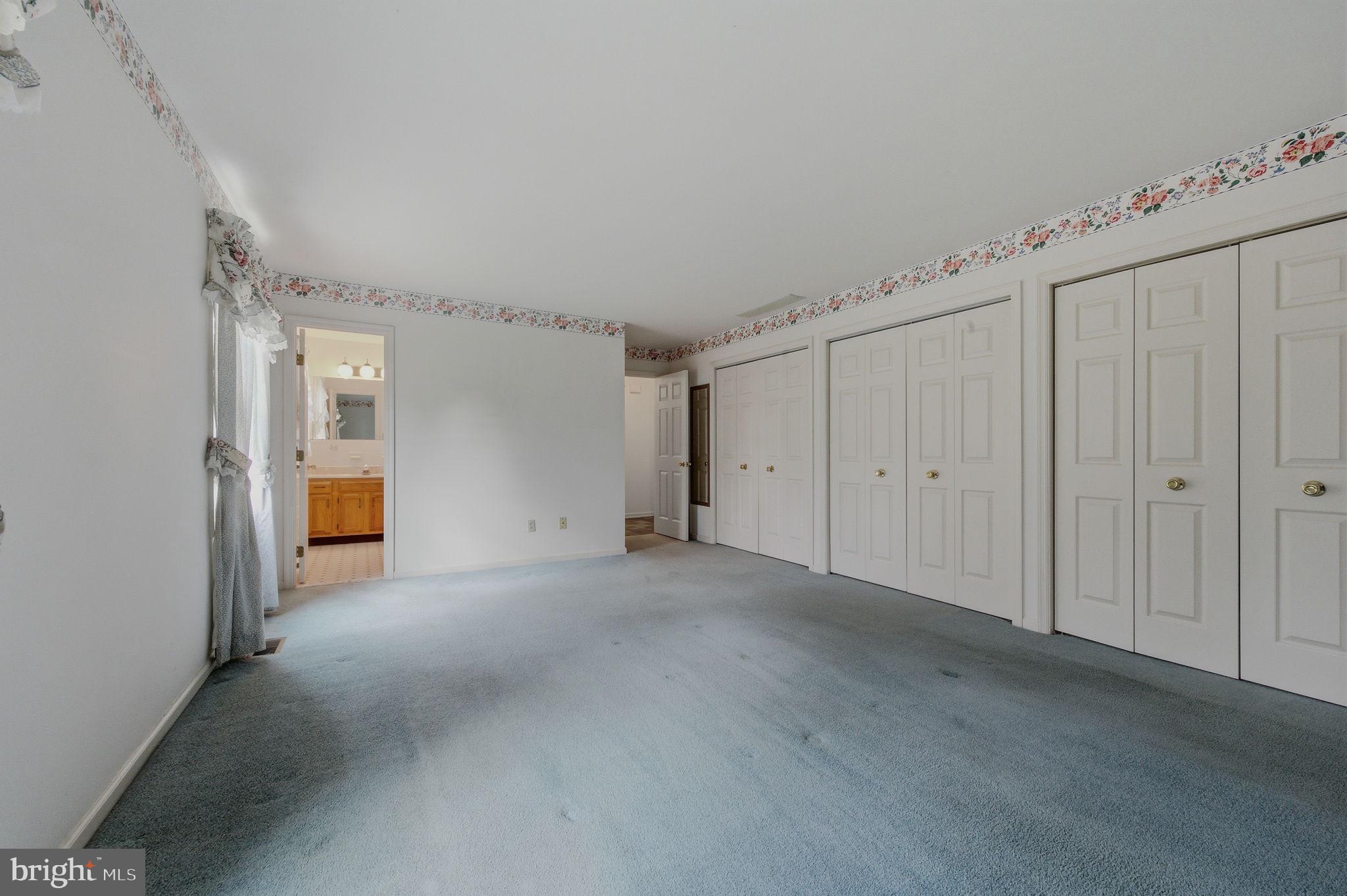 23 Raphael Road Hockessin, DE 19707 - Photo 26 of 44 a view of a livingroom with an empty space