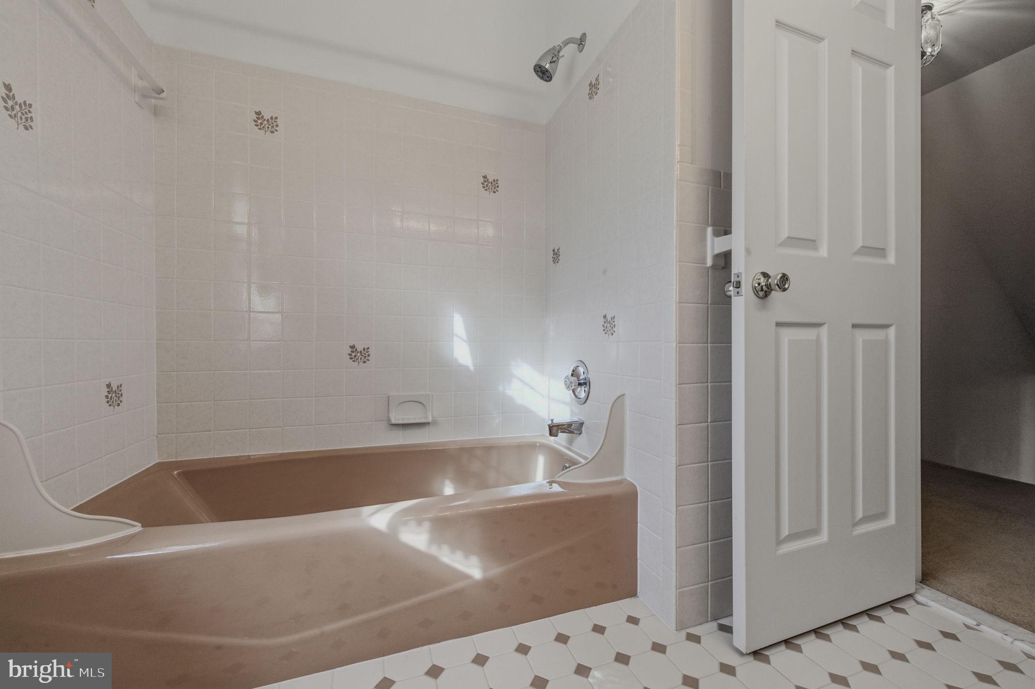 23 Raphael Road Hockessin, DE 19707 - Photo 33 of 44 a bath tub sitting next to a bathroom