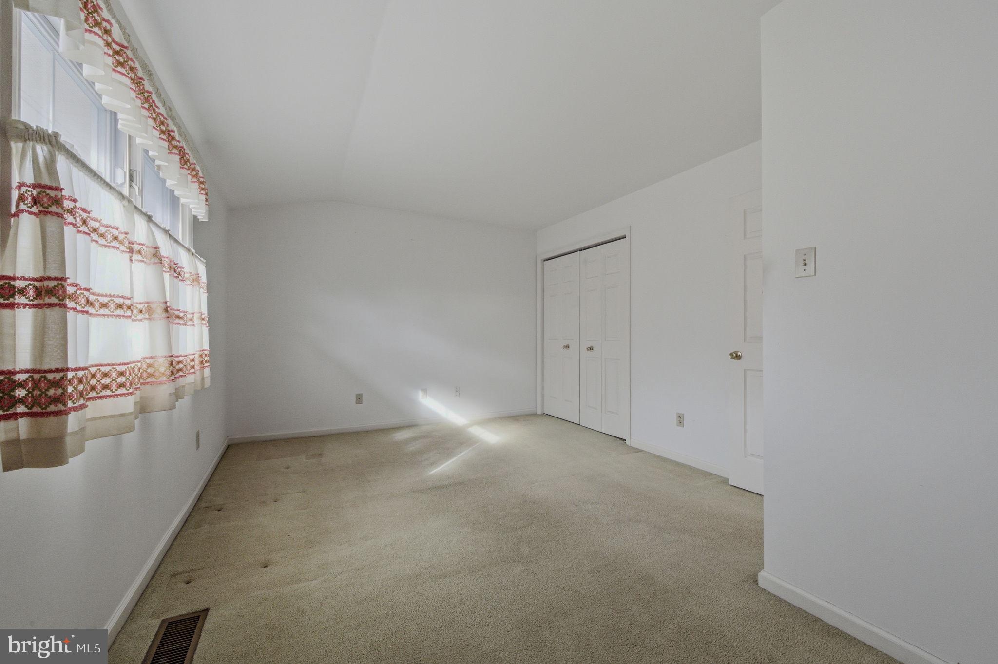 23 Raphael Road Hockessin, DE 19707 - Photo 35 of 44 a view of an empty room with a window