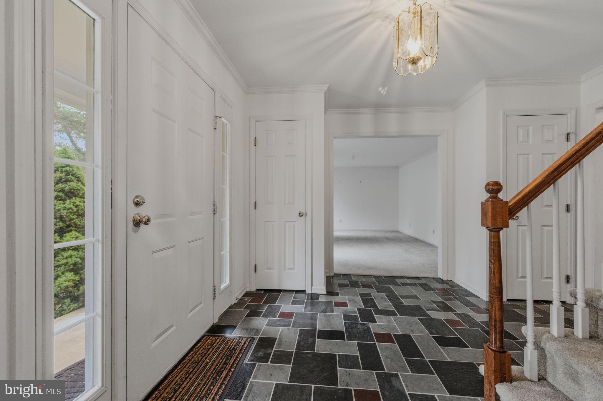 23 Raphael Road Hockessin, DE 19707 - Photo 5 of 44 a walk in closet with wooden floor