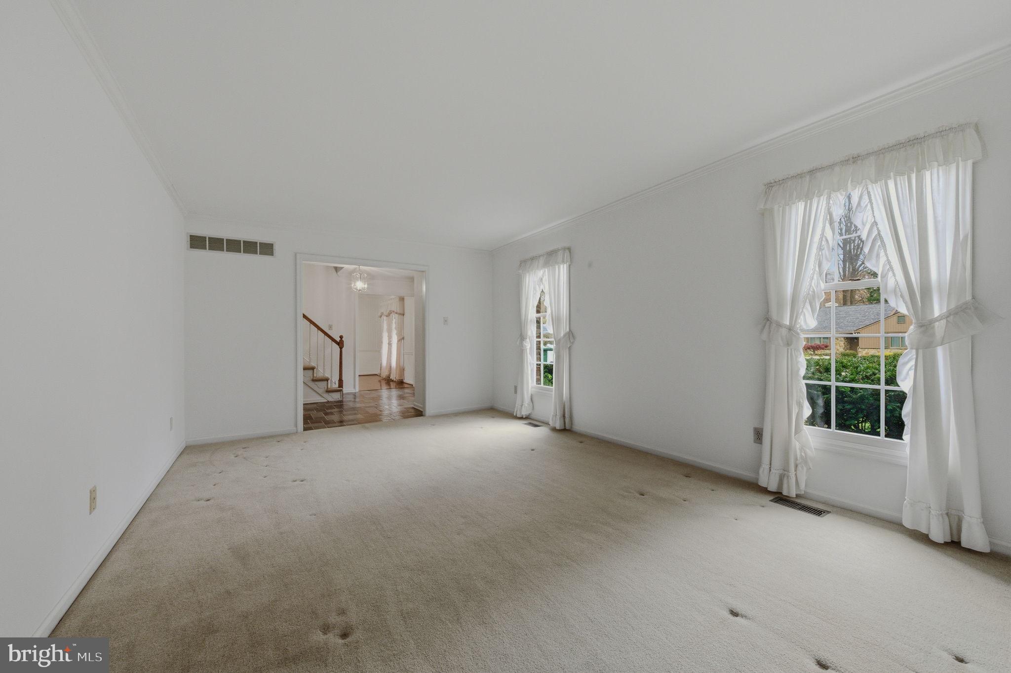 23 Raphael Road Hockessin, DE 19707 - Photo 9 of 44 an empty room with windows
