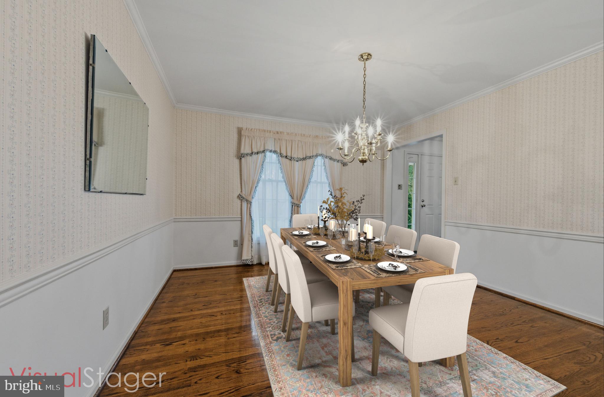 23 Raphael Road Hockessin, DE 19707 - Photo 10 of 44 a view of a dining room with furniture and chandelier