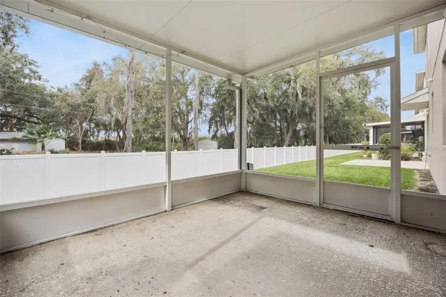 a view of an empty room with windows