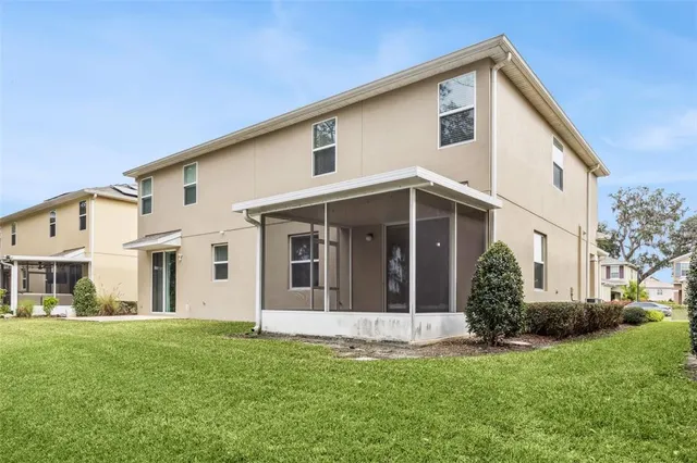 a front view of a house with a yard and porch