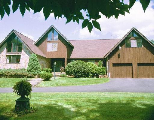 111 St Johns Road Ridgefield, CT 06877 - Photo 1 of 1 a front view of a house with a yard