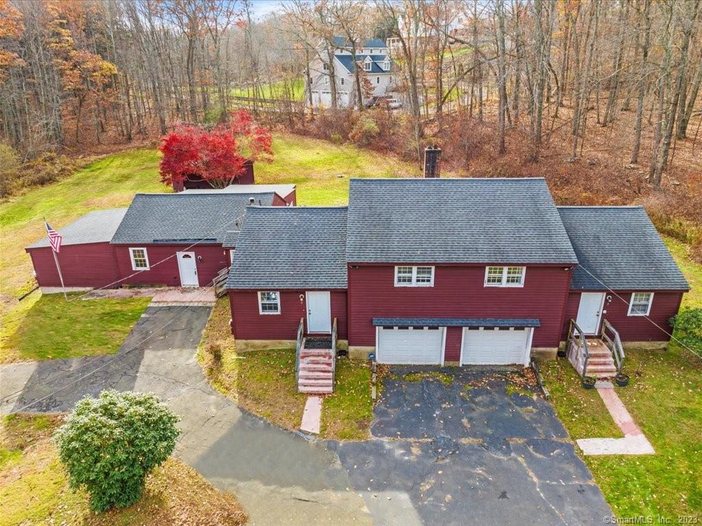 an aerial view of a house with swimming pool