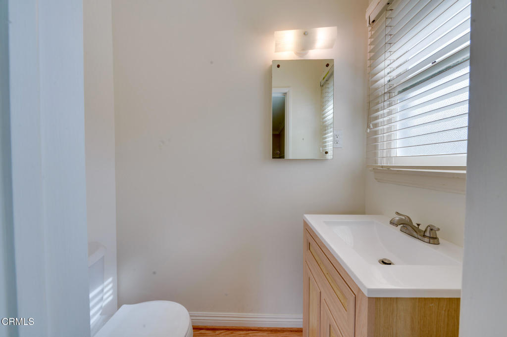 1360 Blackstone Road San Marino, CA 91108 - Photo 11 of 31 a bathroom with a toilet sink and mirror