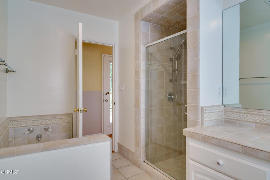 1360 Blackstone Road San Marino, CA 91108 - Photo 15 of 31 a bathroom with a shower sink and mirror