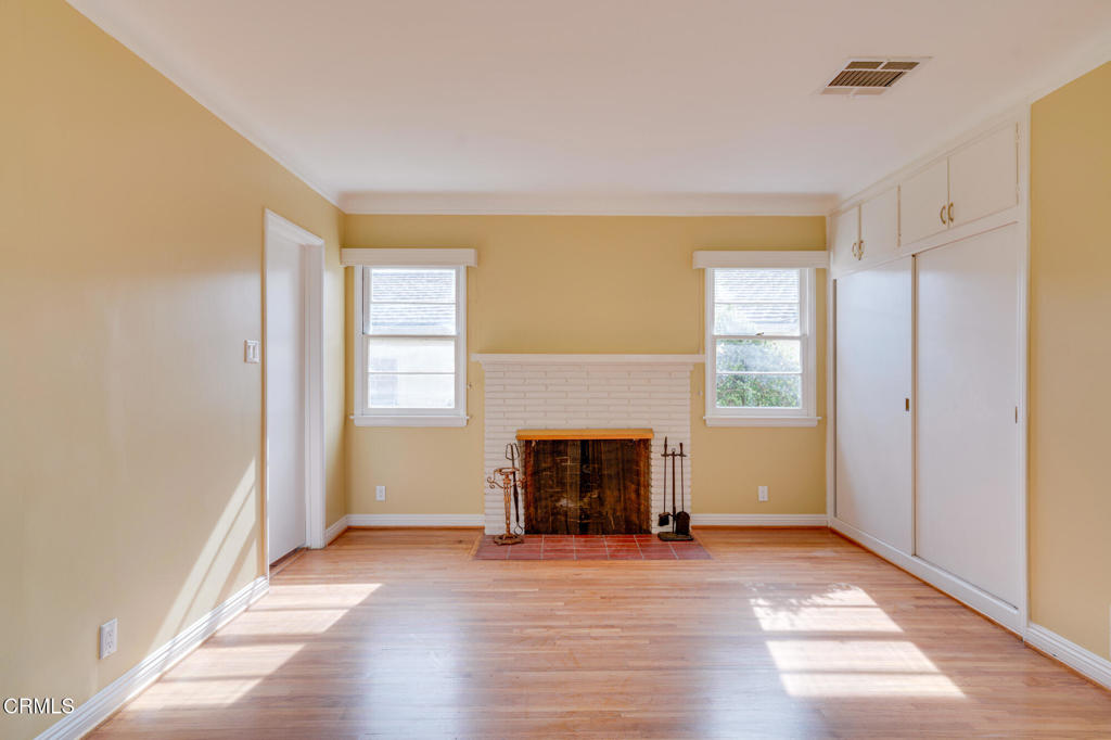 1360 Blackstone Road San Marino, CA 91108 - Photo 19 of 31 a view of an empty room with window and fire place