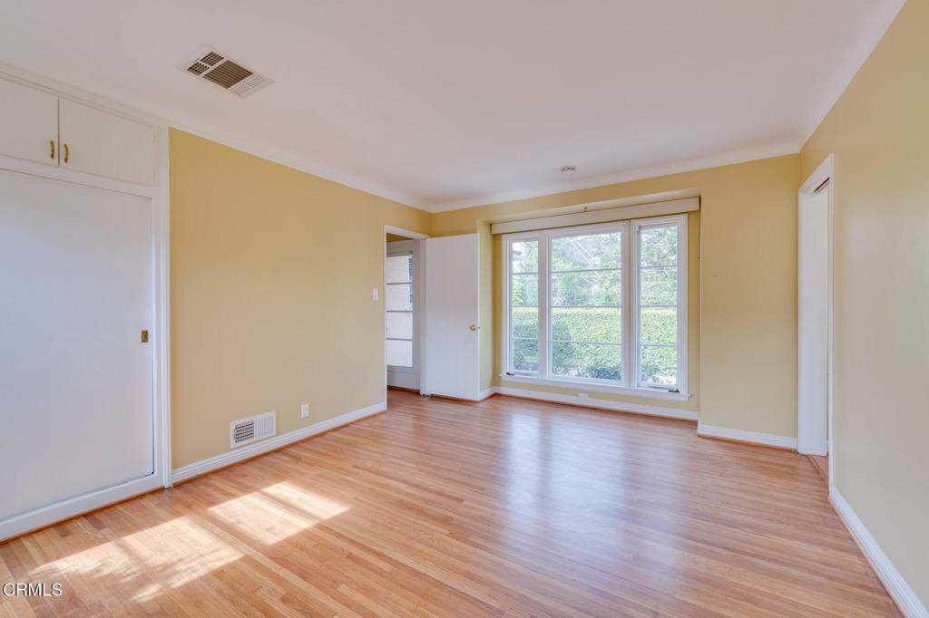 1360 Blackstone Road San Marino, CA 91108 - Photo 20 of 31 a view of an empty room with wooden floor and a window