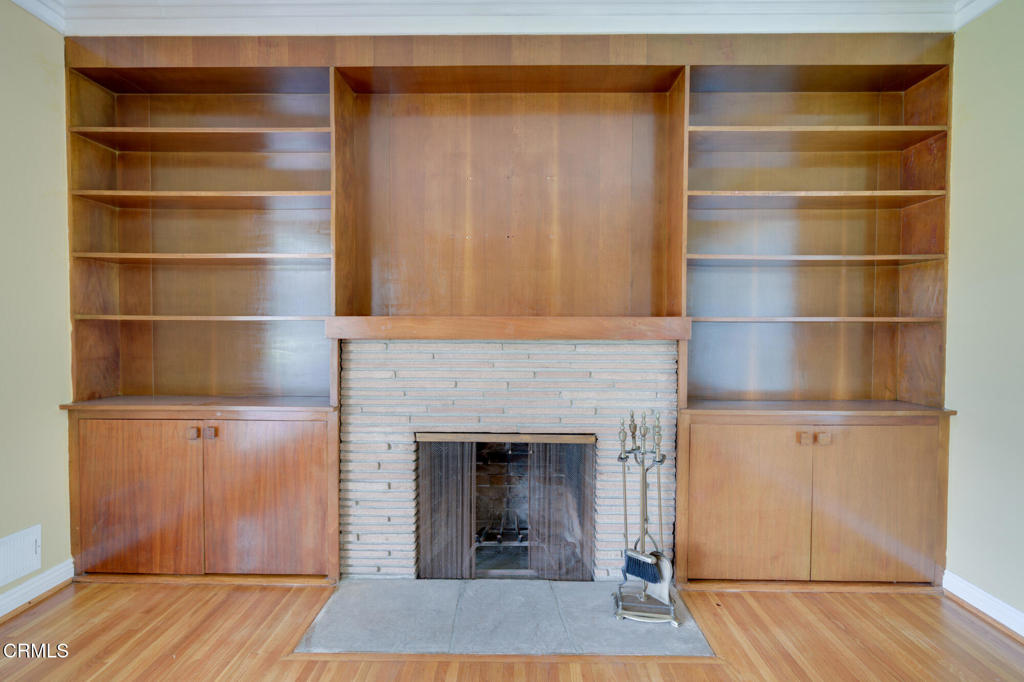 1360 Blackstone Road San Marino, CA 91108 - Photo 4 of 31 a living room with a wooden floor and a fireplace