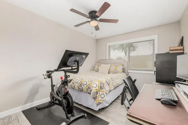 a bedroom with bed and a window
