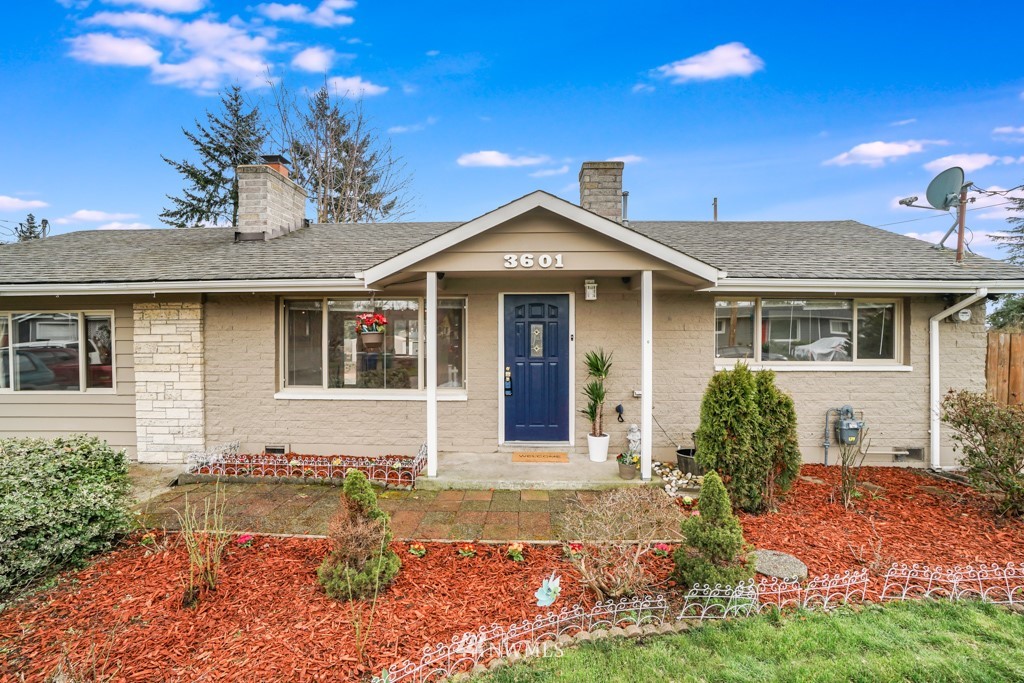 3601 Northeast 9th Street Renton, WA 98056 - Photo 1 of 23 a front view of a house with a yard