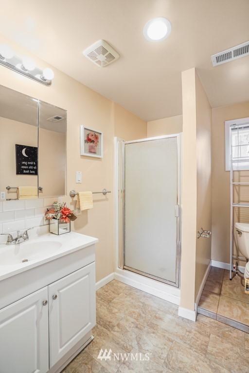 3601 Northeast 9th Street Renton, WA 98056 - Photo 15 of 23 a bathroom with a sink double vanity and a shower