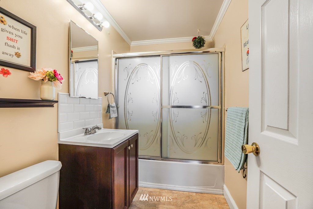 3601 Northeast 9th Street Renton, WA 98056 - Photo 18 of 23 a bathroom with a granite countertop sink toilet and shower
