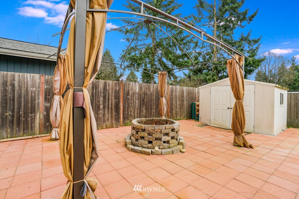 3601 Northeast 9th Street Renton, WA 98056 - Photo 20 of 23 a backyard of a house with table and chairs