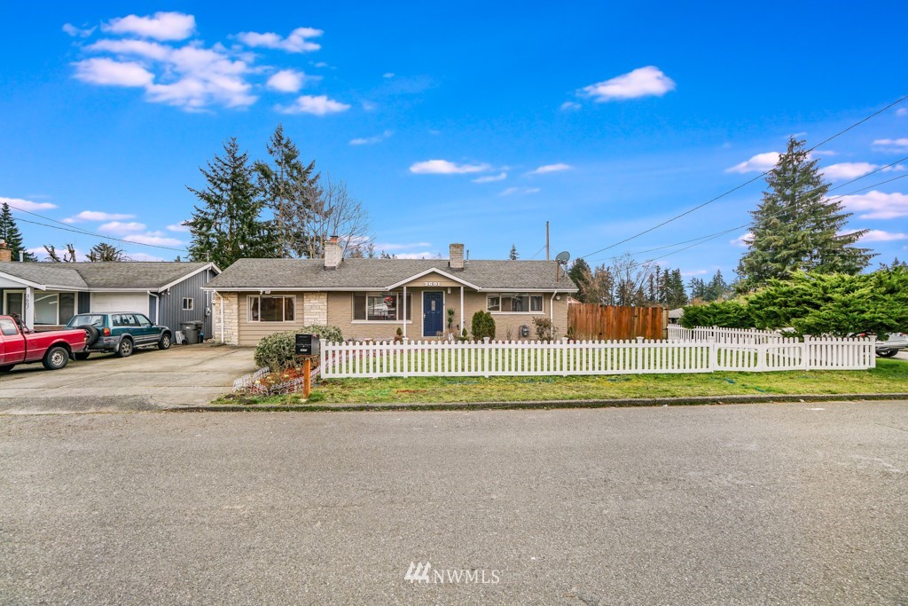 3601 Northeast 9th Street Renton, WA 98056 - Photo 3 of 23 a front view of a house with a garden and pathway