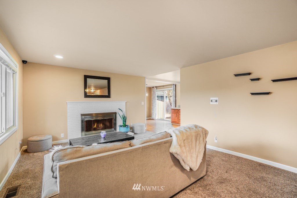 3601 Northeast 9th Street Renton, WA 98056 - Photo 6 of 23 a living room with furniture and a fireplace