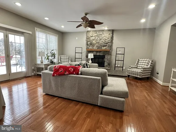 a living room with furniture window and wooden floor