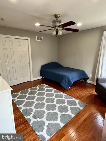 a bedroom with a bed and a walk in closet