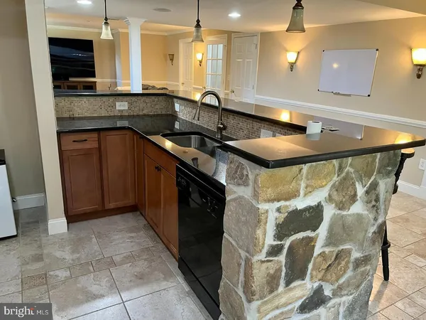 a kitchen with a sink and cabinets