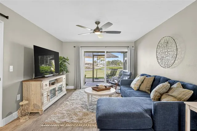 a kitchen with sink refrigerator and cabinets