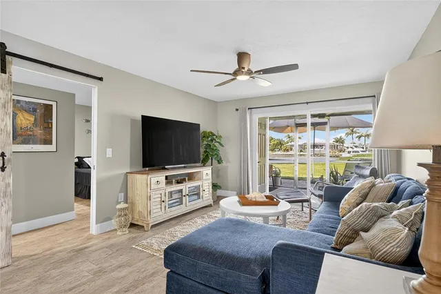 a kitchen with granite countertop white cabinets and appliances