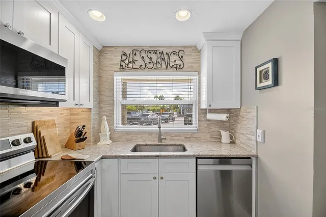 a view of a livingroom with furniture and a window