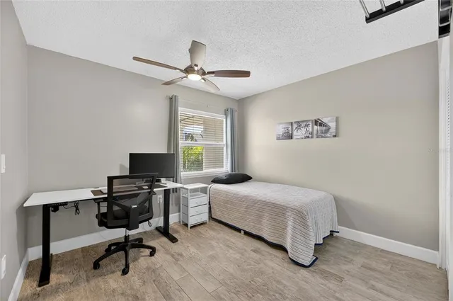 a dining room with furniture and a window