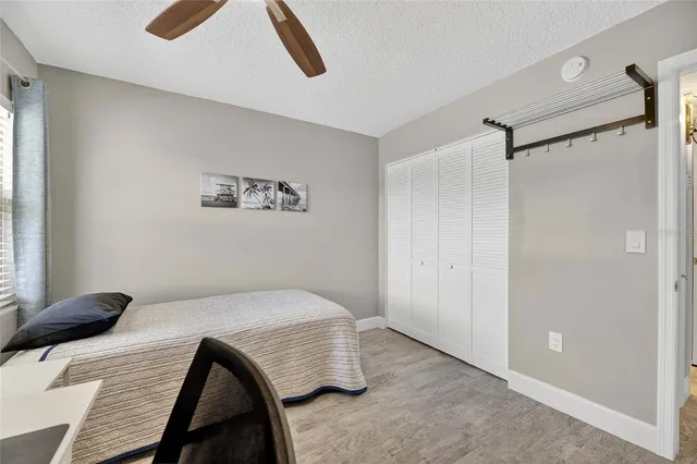 a living room with furniture and a dining table