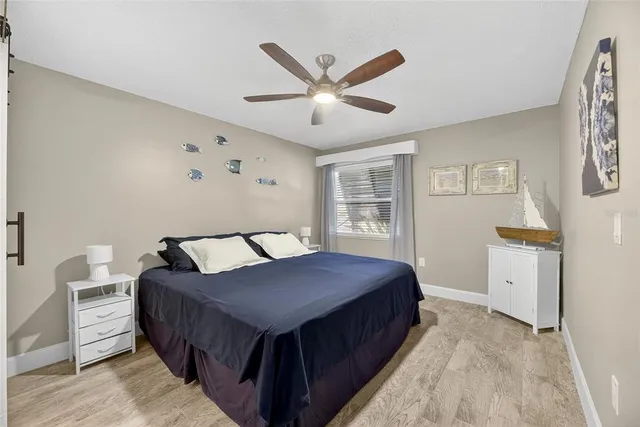 a kitchen with a sink a refrigerator and a stove top oven