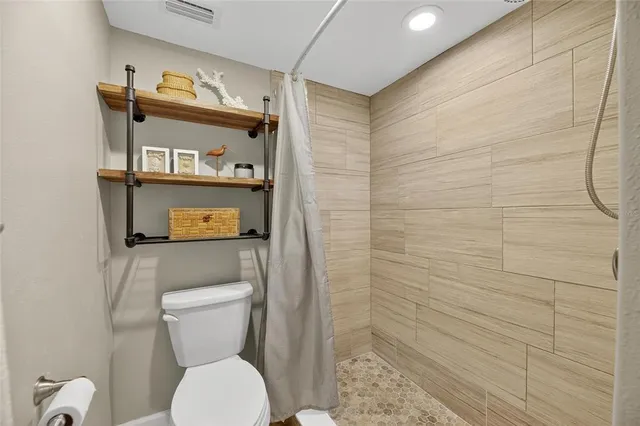 a view of an house with backyard and outdoor seating